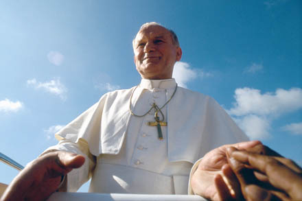 People reach out to Pope John Paul II during his 1981 visit to the Philippines. His 104 trips outside Italy made him by far the most widely traveled pope in history. (CNS photo/Catholic Press Photo) (March 20, 2014) See stories SAINTS- to come.